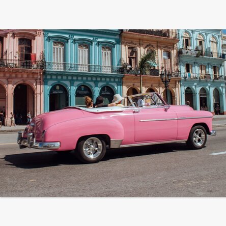 Vintage pink car on the street poster